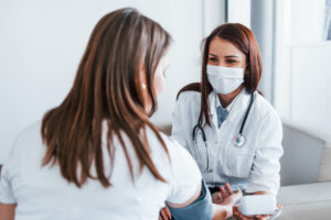 female provider and female patient wearing masks during appointment 