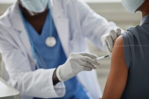doctor giving the flu shot to a patient